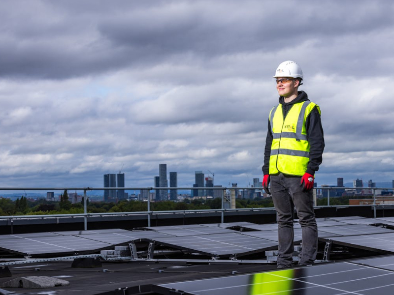 Technician wearing a neon yellow high-visibility vest